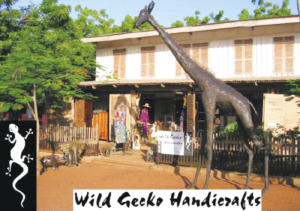Giant elephant and giraffe statutes welcome you to Wild Gecko